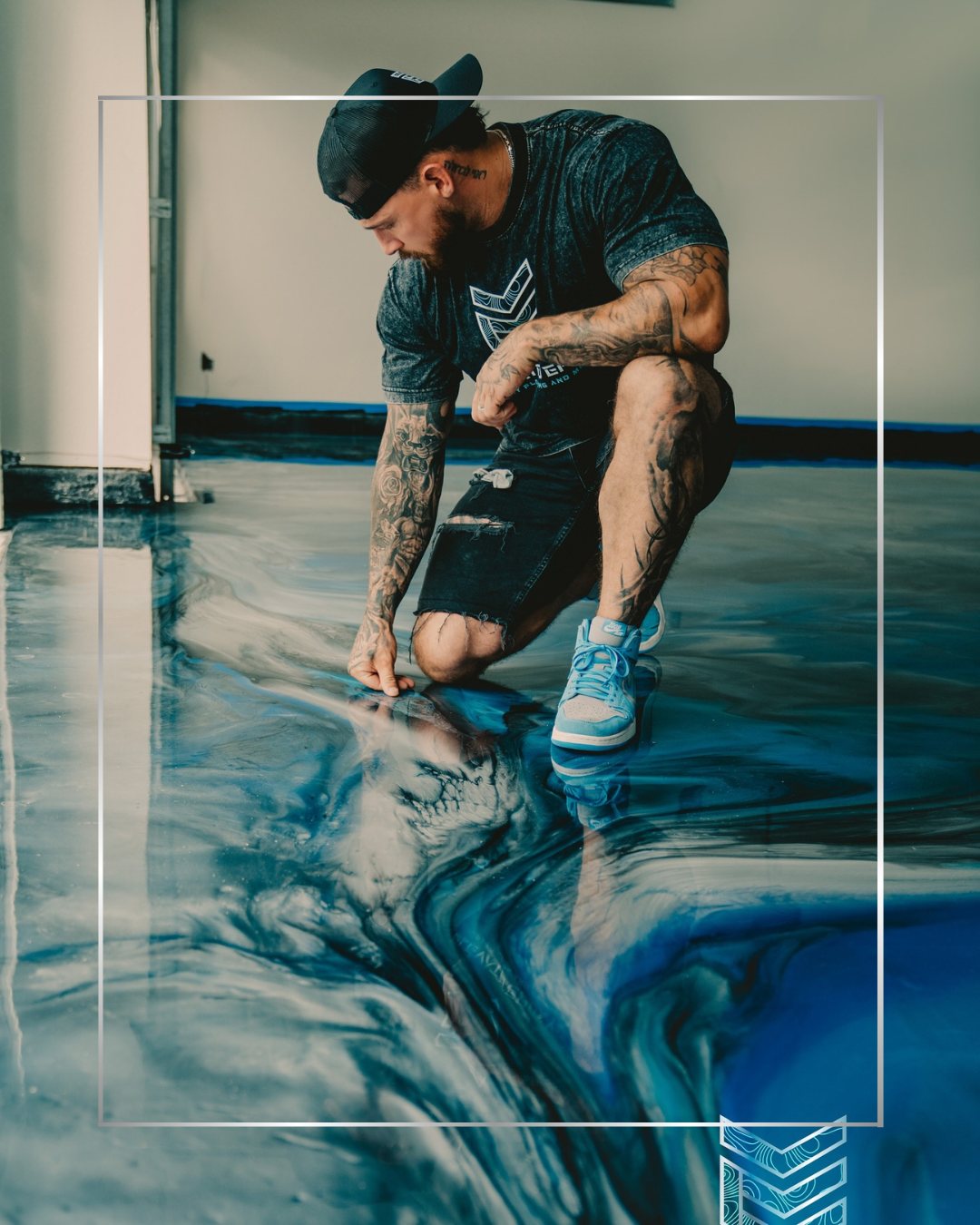 Ryan hand-working a blue metallic epoxy floor