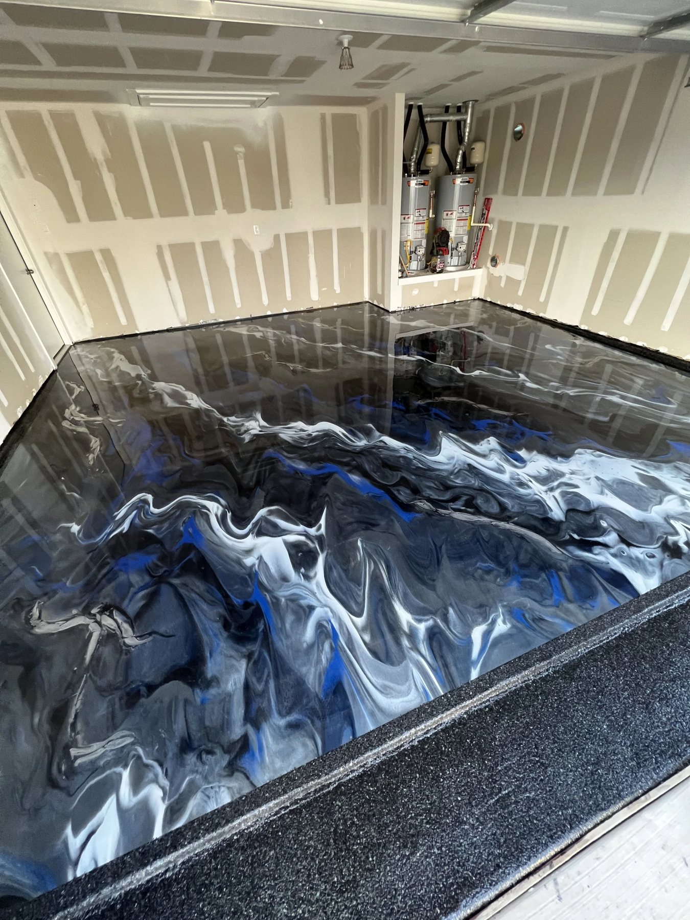 Blue and white metallic epoxy garage floor
