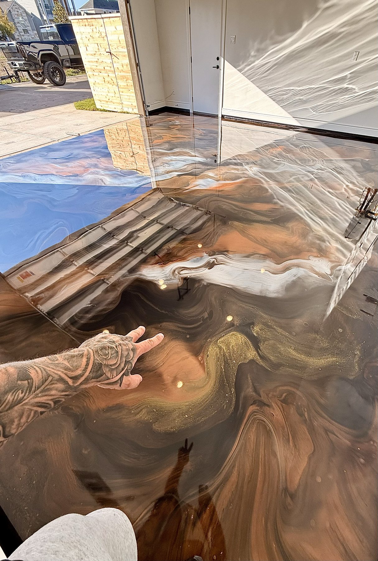 Bronze metallic epoxy floor with a glassy finish