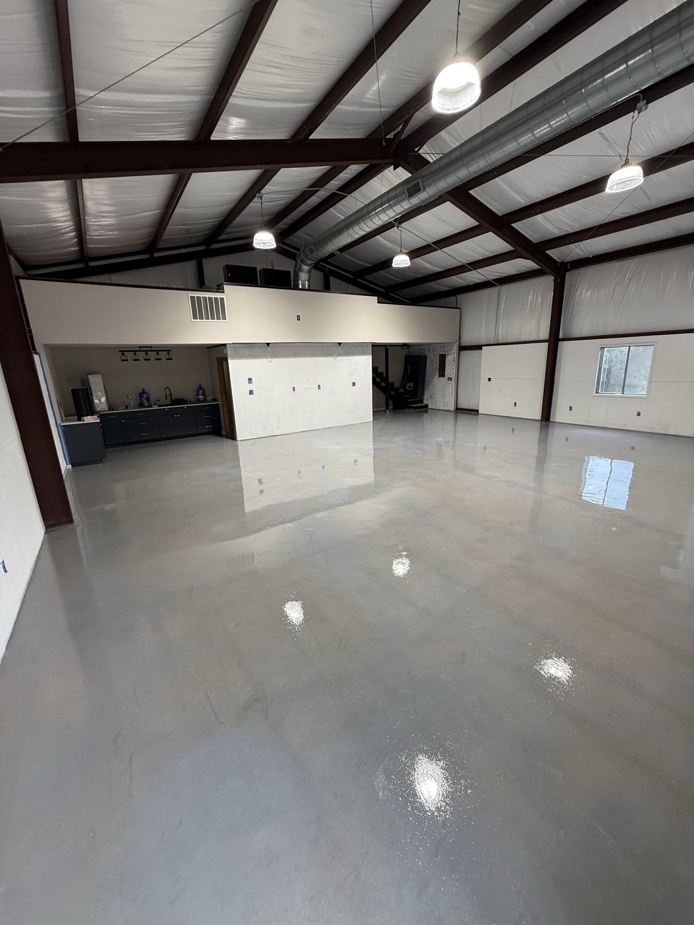 High-gloss commercial floor in a steel building