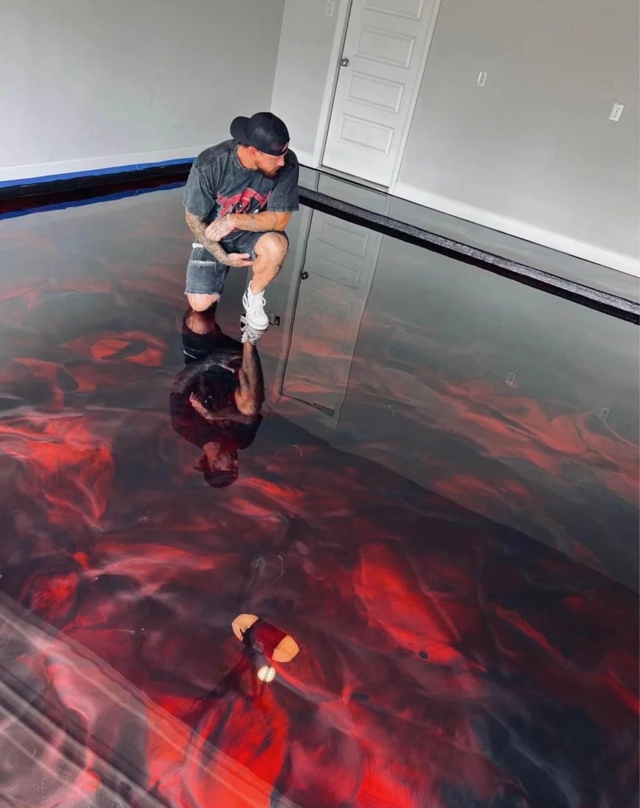 Deep red metallic epoxy floor with mirror reflection
